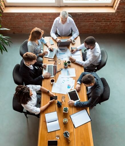 Dental executives in team meeting 