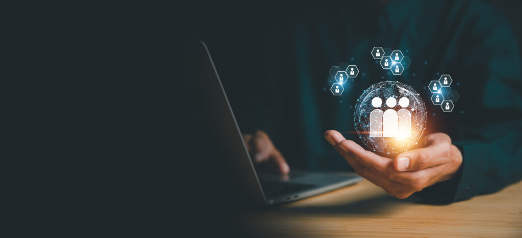 A businessman using a computer to manage Customer Relationship Management (CRM) and global HR processes, focusing on recruitment, employment, and headhunting strategies